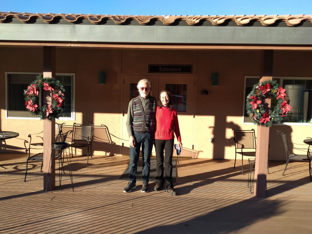 New owners Alex and Josy in front of tasting room entrance
